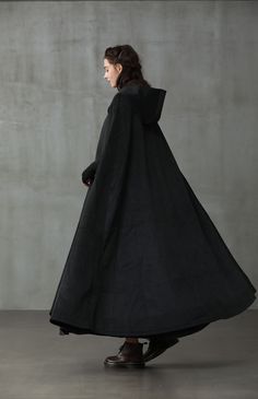 "Few things will make you want to leave your house on a chilly day, but this cloak coat will provide the encouragement you need. Since \"Linennaive Cloak\" being a hot keyword on social media these years, the team have upgraded till now 11 versions to create awe-inspiring quality wool cloaks. Crafted with a maxi length and a thick wool construction this tailored outwerwear ensures you'll remain perfectly comfortable on even the chilliest of days. Featuring the Grade A cashmere, deep side pockets Dark Cloak, Wool Coat Outfit, Cloak Black, Black Cloak, Hooded Wool Coat, Cashmere Cape, Black Cape, Black Winter Coat, Hooded Cape