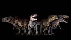 a group of dinosaurs standing next to each other