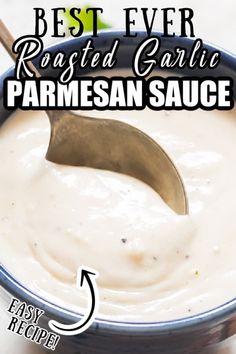 the best ever roasted garlic parmesan sauce in a blue bowl with a spoon