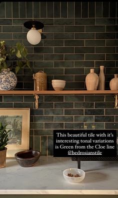 a kitchen counter with bowls and vases on the shelf above it, along with a quote by an unknown person