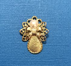 "This little beauty is available in four finishes. Bright gold, bright silver, antique gold, and antique silver with a contrasting bow with a pearl head. Size: 1 1/8\"x 3/4\"" Vintage Gold Jewelry With Ribbon, Gold Jewelry With Decorative Bow For Wedding, Elegant Gold Brooches With Ribbon, Elegant Gold Brooches For Festive Occasions, Elegant Gold Metal Brooches, Vintage Gold Jewelry With Decorative Bow, Gold Bow Brooch For Wedding, Gold Brooch With Bow For Wedding, Angel Pin