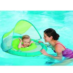 a woman and child in the pool with an inflatable floater on their back