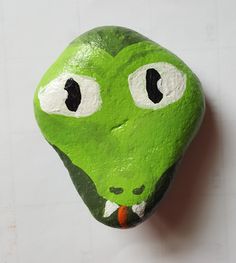 a rock with a face painted on it