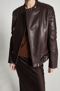 Crafted from soft calf leather and adorned with moto-inspired zipper and bucket details, the Marcos Leather Moto Jacket in dark burgundy is a timeless staple for any wardrobe. With its lined interior and versatile color, this jacket is both stylish and practical, ensuring years of wear and effortless styling options. Elevate your look with this classic piece. Luxury Brown Biker Jacket With Zipper, Luxury Brown Biker Jacket With Zipper Closure, Brown Leather Jacket With Zip Cuffs For Work, Brown Leather Outerwear With Zip Cuffs, Luxury Leather Biker Jacket With Asymmetrical Zip, Luxury Leather Outerwear With Asymmetrical Zip, Luxury Biker Jacket With Asymmetrical Zip For Fall, Luxury Asymmetrical Zip Biker Jacket For Fall, Brown Leather Outerwear With Asymmetrical Zip