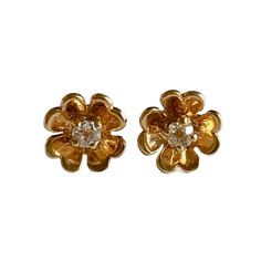 These stunning Four Leaf Clover earrings are crafted out of 14K Gold and feature a prong set eye clean Old Mine Cut Diamond in each earring. These beautiful earrings are sure to bring good luck to whoever wears them! Note: all of the following measurements are approximate Item Details Overall Dimensions: 9.08mm X 9.08mm Diamond: 2.90mm - 3.07mm, (0.20 Carat CTW) Color: L - M, Clarity: SI1 Birthdate Stone: April Weight: 2.0gm Hallmark: None - tested as 14K (backs are marked 14K) Closure: Push Bac Formal Yellow Gold Flower Earrings With Prong Setting, Classic Flower Earrings, Classic Gold Diamond Flower-shaped Earrings, Classic 14k Gold Flower Earrings For Anniversary, Classic Yellow Gold Flower Earrings For Formal Occasions, Classic Pierced Flower Shaped Earrings, Classic Pierced Flower-shaped Earrings, Heirloom Yellow Gold Diamond Earrings Gift, Heirloom Style Yellow Gold Diamond Earrings For Gift