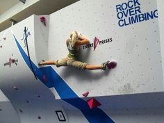 a man climbing up the side of a rock wall