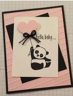 a card with a panda holding a heart on it's back and the words hello baby written in black ink