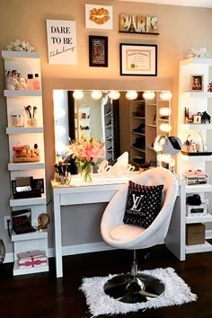 a white chair sitting in front of a mirror on top of a wooden floor next to a desk