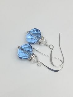 "12x10mm Light blue sapphire faceted crystal glass silver plated brass earrings the length with the hook is 1.25\". Hand made jewelry! All purchase will arrive in gifts boxes. Thanks for stopping by!" Blue Crystal Earrings With Ear Wire For Formal Occasions, Blue French Hook Jewelry As Gift, Blue Sterling Silver Earrings With French Hook, Blue Crystal Earrings With Ear Wire As Gift, Blue Sterling Silver Crystal Earrings With Ear Wire, Blue Crystal Earrings With Lever Back For Gift, Elegant Light Blue Crystal Earrings For Gift, Sterling Silver Blue French Hook Earrings, Blue Crystal Earrings With Sterling Silver Ear Wire