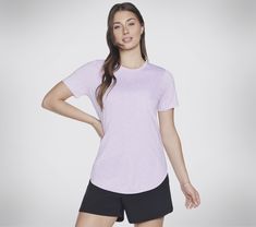 Skechers GO WALK Wear GO DRI Swift Tunic Tee will be your favorite go-to staple, perfect for mindful yoga sessions and laid-back weekends. This tunic tee features a soft moisture-wicking and quick-drying GO DRI SWIFT brushed fabric, round neckline, and a high-low hem with side slits. | Skechers Women's GO DRI Swift Tunic T-Shirt | Skechers GO DRI SWIFT lightweight brushed back fabric features a 4-way active stretch, moisture wicking, quick-drying, and UPF 40+ properties | Short sleeve tunic silh Mindful Yoga, Skechers Go Walk, High Low Shirt, Short Sleeve Tunic, Skechers Women, Silhouette Design, High Low Hem, Fashion Tees, Womens Clothing Tops