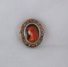 "Absolutely beautifully hand painted Venetian Portrait Brooch C1900's The setting is 800 silver and decorated with red coral stones. The portrait is exquisite and in excellent condition. Measures 1-3/8 x 1-1/4\" across the setting. The portrait is 1\" x 3/4\" There is a bale and may be worn as a pendant. Exceptional piece." Coral Stone, Pearl Brooch, Red Coral, 1960s Vintage, Silver Turquoise, Blue Glass, Class Ring, Brooches, Gemstone Rings