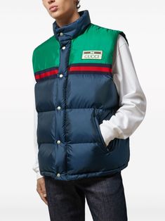 Padded vest by GUCCI in blue and green characterized by logo patch, sleeveless, button closure and drawstring waist. This item is in size 48 and the color is Gucci Outerwear With Pockets For Streetwear, Gucci Cotton Outerwear With Pockets, Gucci Sporty Streetwear Outerwear, Casual Blue Outerwear With Logo Patch, Gucci Sporty Outerwear For Streetwear, Sporty Gucci Outerwear For Streetwear, Casual Green Vest Outerwear, Gucci Casual Cotton Outerwear, Casual Gucci Cotton Outerwear