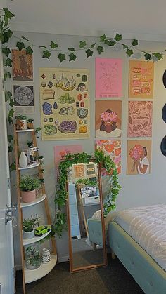 a bed room with a neatly made bed and lots of pictures on the wall