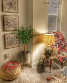 a living room filled with furniture and pictures on the wall