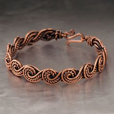 The bracelet is made of pure copper wire. The copper is artificially aged with patination, which gives an antique look and makes the details of the bracelet more expressive. After patination, the bracelet was polished to a shine, which gives a beautiful aesthetic appearance to the bracelet. The bracelet is covered with a protective varnish to prevent darkening.You will receive the exact bracelet you see in the photos.The bracelet can be combined with any wardrobe and emphasize your uniqueness and style. Bracelet Width: 0.4" (1 cm)  PLEASE NOTEChoose the desired length of the bracelet from the suggested options. To correctly choose the size of the bracelet, you need to add 0.6" (1.5 cm) to the size of your wrist girth. You will get the length of the bracelet that suits you.For example. If y Wire Wrap Bangle, Copper Jewelry Diy, Wire Weaving Techniques, Metal Art Jewelry, Wire Jewelry Patterns, Wire Crochet Jewelry, Wire Wrap Jewelry Designs, Wire Jewelry Making, Wire Wrapped Bangles