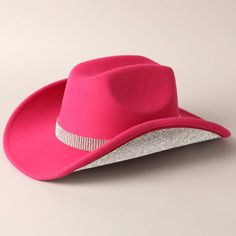 This Vegan Felt Cowboy Hat features a dazzling rhinestone trim design and a stunning rhinestone belt wrapped around the crown. All materials used are man-made for a cruelty-free option. Plus, an adjustable strap ensures a perfect fit for smaller heads. 100% polyester for comfort and durability. Pink Rhinestone Cowboy Hat, Pink Glitter Cowboy Hat, Western Pink Hat With Curved Brim, Rhinestone-embellished Short Brim Hat For Rodeo, Pink Sparkly Cowboy Hat, Felt Cowboy Hat, Scarf Coverup, Rebecca Black, Trim Design