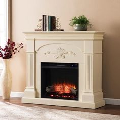 a living room with a fire place and a vase on the floor next to it