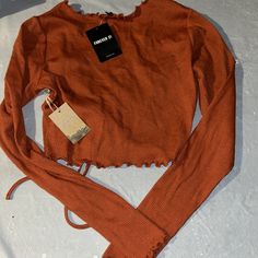 Forever 21 Long Sleeve Crop Top String Up In The Front Brand New $14.99 Now Only $8 Size Small Rust Knit Top Trendy Crew Neck Crop Top For Fall, Trendy Stretch Crop Top For Fall, Forever 21 Casual Long Sleeve Crop Top, Casual Long Sleeve Crop Top By Forever 21, Trendy Knit Crop Top With Crew Neck, Trendy Crew Neck Knit Crop Top, Trendy Cotton Crop Top For Fall, Trendy Knit Crew Neck Crop Top, Fall Crew Neck Knit Crop Top