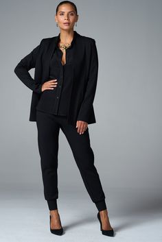 Crafted in luxe ponte with plenty of stretch, this sleek blazer feels like a second skin. Pair it with any of our coordinating pants for a thoroughly modern suit. ✓ Wrinkle Free ✓ Four-Way Stretch ✓ Office Ready ✓ All-Day Comfort ✓ Day to Night ✓ Core Collection DETAILS Open front Single fabric-covered button Patch pockets FIT Regular fit True to size Model is 5'8" and wears size S MEASUREMENTS Center back length: 26.5" (size S) FABRIC + CARE 67% rayon, 30% nylon, 3% Spandex Dry clean only. Night Core, Modern Suits, Ponte Pants, Fabric Covered Button, La Fashion, Black Xs, Black Blazers, Wrinkle Free, Off Duty