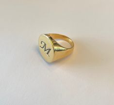 signet ring - Pinky ring - Personalized Ring - Initial Ring - Best quality 18k Gold Plate Engraving your initial or your name. Seal diameter: 20 mm The product will arrive to you packed in gift box and padded envelope to maintain the product Thank you for your interest. Please check out our other items and be sure to add us to your favorites! https://www.etsy.com/shop/Limajewelry We look forward to the opportunity of serving you. Vintage Rings With Engraving Option, Symbolic Engraved Ring With Initials, Vintage Round Rings With Engraving Option, Engraved Round Rings For Gift, Personalized Vintage Engraved Ring, Vintage Engraved Personalized Ring, Symbolic Personalized Engraved Round Ring, Signet Ring With Engraving Option As Gift, Gift Signet Ring With Engraving Option