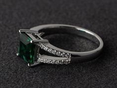 Welcome to my shop, you can find many beautiful gemstone jewelry here, and you also can ask for customized service. Main Stone: lab emerald, square cut 7X7mm, weight about 1.60 carats.Accent Stones: cz Metal: 925 sterling silver plated with rhodium. I also can provide metal options such as 14k solid yellow/white/rose goldSetting: prong setting More rings: https://www.etsy.com/shop/XCjewelryStudio?ref=hdr_shop_menuEmerald is May birthstone and the ring is quite comfortable for wearing and suitabl Asscher Cut Green Emerald Promise Ring, Green Asscher Cut Emerald Ring For Promise, Green Asscher Cut Emerald Ring With Accent Stones, Green Asscher Cut Emerald Promise Ring, Green Princess Cut Rings With Accent Stones, Green Emerald Ring With Princess Cut And Halo Setting, Green Emerald Ring With Halo Princess Cut, Square Cut Emerald Ring For Anniversary, Green Emerald Ring With Princess Cut Center Stone