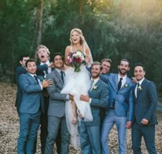 a bride and groom with their wedding party