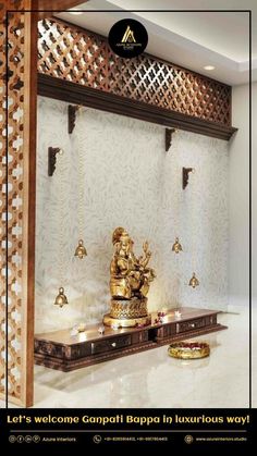 a golden statue sitting on top of a white floor next to a wooden shelf filled with candles