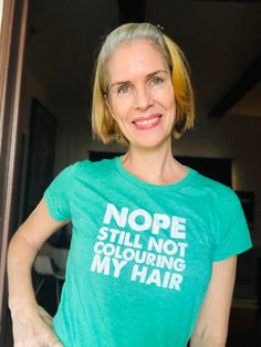 This tee will help you to survive the first 6 months of Silver Journey. We know, how tough it can be for some of us. I personally went through "weird" or "ugly" phase and one thing that I did not want to hear is comments about my shining roots and demarcation line. So, if you’re done with the dye, this is the perfect Tee in which to announce it to the world! Funny Green T-shirt With Slogan, Fun Green T-shirt With Slogan, Transition To Gray Hair, Silver Fox, Grey Hair, Silver Hair, Fun Prints, My Hair, Color Me