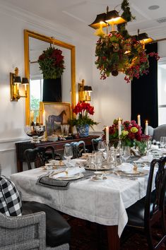 the dining room table is set for christmas dinner