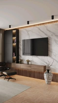 a living room with a large tv mounted on the wall