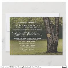 an elegant wedding card with a tree and heart in the middle is displayed on a white background