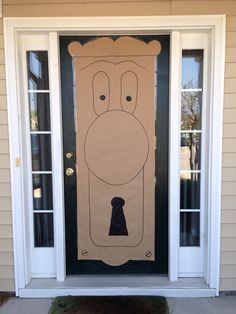 a cardboard door with a drawing of a man's face on it