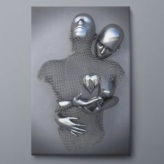 two metal figures are holding each other in the shape of a heart and hands on a gray background