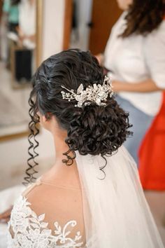 the back of a bride's head wearing a bridal hair comb