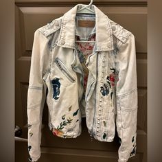 - Blanknyc Floral Embroidered Studded Moto Denim Jacket - Color “Dusty Blue,” Light Denim - Size Small - Fitted Moto Style - Zippers & Silver Stud Embellishments - Beautiful Pink, Red, Yellow, Green And Blue Floral Embroidery - New, Never Worn, Perfect Condition Spring Bohemian Distressed Outerwear, Casual Long Sleeve Biker Jacket With Floral Embroidery, Cotton Long Sleeve Biker Jacket For Spring, Trendy Cotton Biker Jacket For Spring, Embroidered Long Sleeve Biker Jacket For Spring, Casual Embroidered Biker Jacket For Spring, Casual Embroidered Fitted Biker Jacket, Casual Biker Jacket With Floral Embroidery, Upcycle Clothes Diy