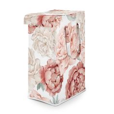 a white and pink flowered tissue box with an open lid on the front side