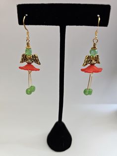 These Christmas Angel earrings are so creative! They have flowers as the dress & gold angel wings. All metal is 14k. gold plated & so are the ear wires.  Arrives in a box, perfect for gift giving. Holiday Jewelry Ideas, Gold Angel Wings, Angel Earrings, So Creative, Holiday Jewelry, Christmas Earrings, Christmas Angels, Jewelry Earrings Dangle, Etsy Earrings