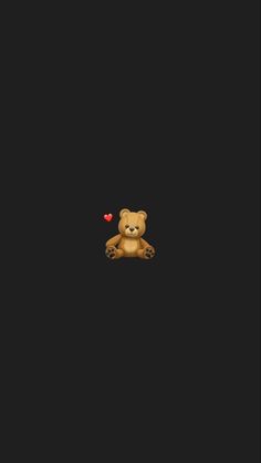 a teddy bear sitting in the dark with a heart on it's chest and eyes closed