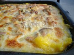 a casserole dish with meat and cheese on it is ready to be eaten