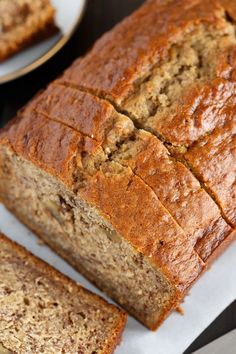 sliced banana bread sitting on top of a piece of paper