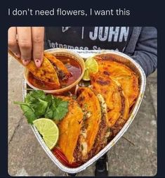 someone is holding a heart shaped dish with food in it and the caption reads i don't need flowers, i want this