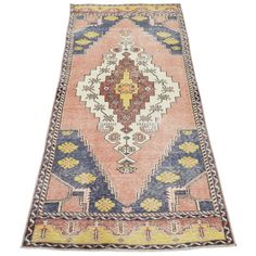 an antique persian rug with multicolored geometric design