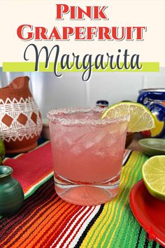 a pink grapefruit margarita on a colorful table cloth