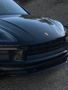 the front end of a black sports car