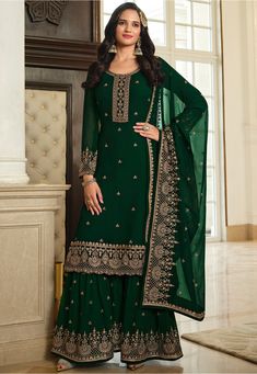 Semi-stitched Faux Georgette Pakistani Suit in Dark Green This Round Neck and Full Sleeve attire with Poly Shantoon Lining is Prettified with Resham, Zari and Sequins Work Available with a Faux Georgette Sharara and a Faux Georgette Dupatta in Dark Green The Kameez and Bottom Lengths are 46 and 40 inches respectively Do note: The Length may vary upto 2 inches. Accessories shown in the image are for presentation purposes only.(Slight variation in actual color vs. image is possible). Green Sharara, Long Anarkali Gown, Plazzo Suits, Long Anarkali, Sharara Suit, Salwar Kamiz, Anarkali Gown, Party Kleidung, Sharara Set