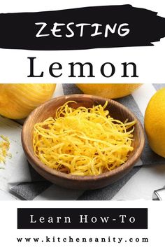 a wooden bowl filled with lemons on top of a table