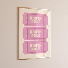 two pink movie tickets hanging on the wall