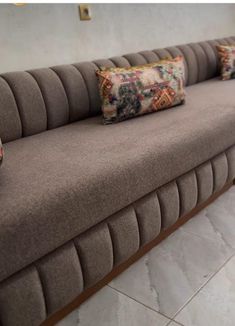 a couch that has some pillows on it