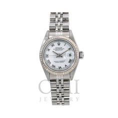 This pre-owned Rolex Lady-Datejust is a classic timepiece that epitomizes elegance and functionality. Featuring an automatic movement, this watch comes with a sophisticated white dial housed in a 26mm case protected by a scratch-resistant sapphire crystal. The white gold bezel adds a touch of luxury, while the stainless steel Jubilee bracelet ensures a comfortable and secure fit. With a water resistance of up to 10 ATM, it is suitable for everyday wear. This model, reference number 69174, comes Buy Rolex, Model Reference, Pre Owned Rolex, White Dial, Rolex Datejust, Watch Collection, Sapphire Crystal, Time Piece, The White