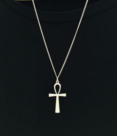 Ankh Silver Tone Necklace. The Ankh is an ancient Egyptian symbol which symbolizes ever lasting life. Pendant sits on a 3mm sturdy silver tone metal chain. Long and Layered, Modern and Edgy. These are just a few words used to describe my hand crafted necklaces. These necklaces make a fantastic addition to your every day wardrobe. You choose the length and chain from the drop down menu.  *All components are lead and nickel free* Spiritual Metal Cross Necklaces, Spiritual Ankh Necklace With Adjustable Chain, Symbolic Metal Cross Necklace, Spiritual Cross Chain Necklace Gift, Ankh Shaped Metal Necklace As Gift, Symbolic Cross Necklace With Adjustable Chain, Ankh Shaped Metal Necklace For Gift, Nickel-free Ankh Necklace As Gift, Symbolic Engraved Cross Necklaces